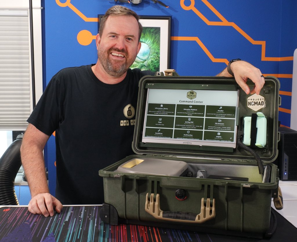 Chris Sherwood with the NOMAD Deck, a portable Project NOMAD server built into a rugged case, open to the Command Center dashboard
